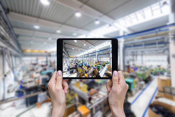 Taking picture of factory on a tablet