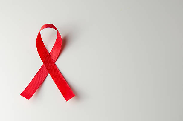 HIV, AIDS Red ribbon HIV, AIDS on gray background, Awareness, Medical sign. copy space. hiv stock pictures, royalty-free photos & images