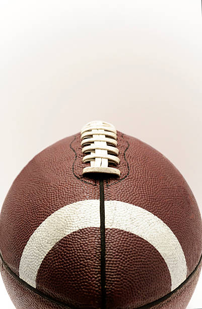istock Brown Football With Laces On A White Background 590073528