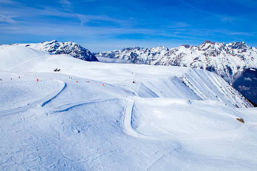 Belledonne mountain Range and Oz en Oisans ski slopes in winter a magnificent day with sun and calm weather. 