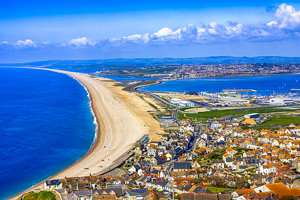 Aerial view of Chesil beach and Portland in Dorset, UK Aerial view of Chesil beach and Portland in Dorset, UK bill of portland stock pictures, royalty-free photos & images