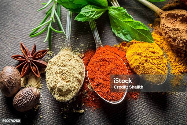 Intensive Condiments On Old Spoons Stock Photo - Download Image Now - Spice, Herbal Medicine, Herb