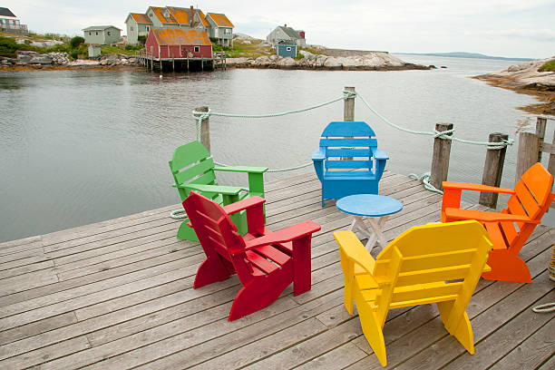 istock Adirondack Chairs in Peggys Cove - Nova Scotia  Canada 590078214