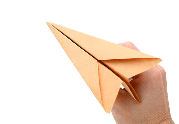 istock hand starts the paper plane 590079262