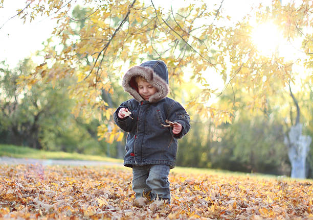 istock Baby in autumn 590080024