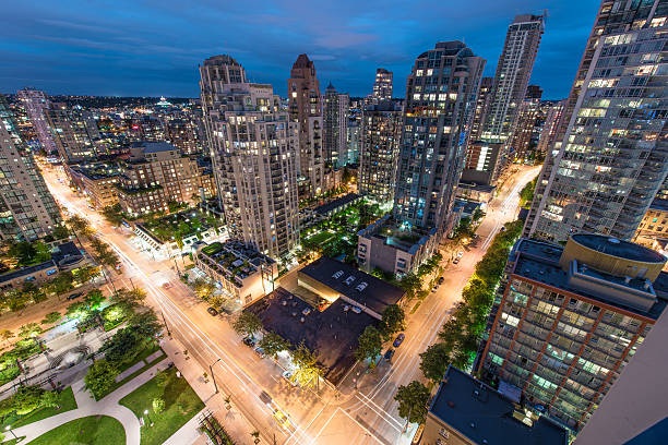 Night streets of Vancouver A view of downtown Vancouver at night, BC, Canada vancouver at night stock pictures, royalty-free photos & images