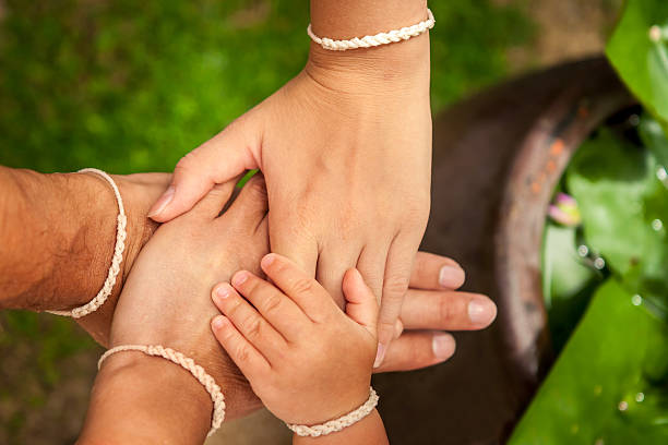 istock Family putting their hands together 590135548