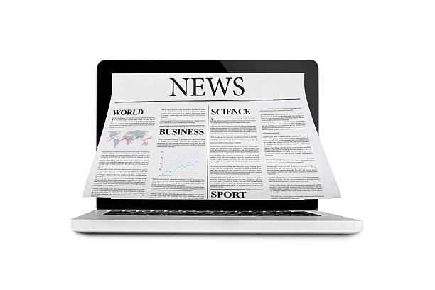 istock Newspaper out of laptop 590137948