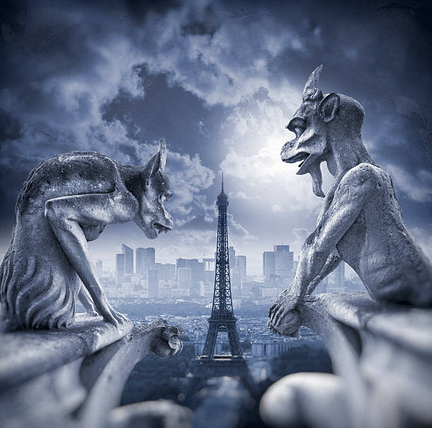 Gargoyle figur on Notre Dame with Eiffel Tower at night