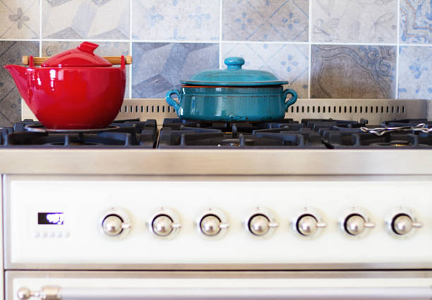 Red and Blue Pots on Pretty Vintage-Style Kitchen Stove