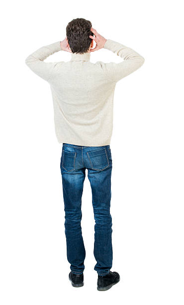 istock Back view of man . Standing young guy. 590139280