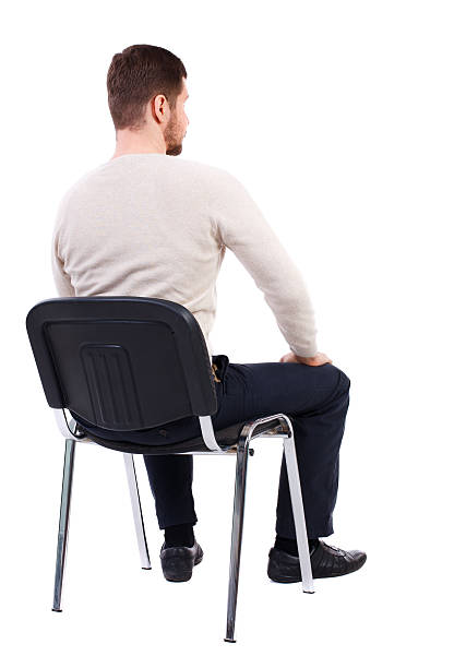 back view of business man sitting on chair. back view of business man sitting on chair. businessman watching. Rear view people collection. backside view of person. Isolated over white background. The bearded man in a white warm sweater sits on a chair. Side view. pics of girls buttocks stock pictures, royalty-free photos & images