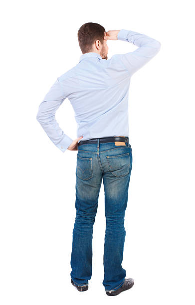 istock Back view of man . Standing young guy. 590139544