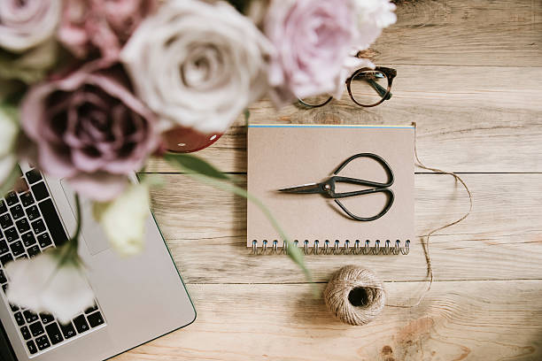 istock crafting tools and flowers on the wooden table background 590139714