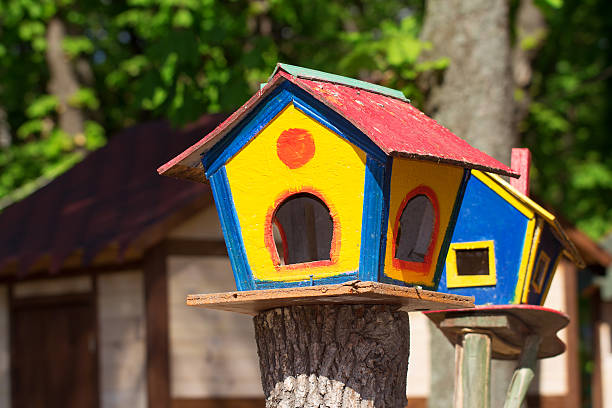 istock Colorful birdhouses in the park 590140196