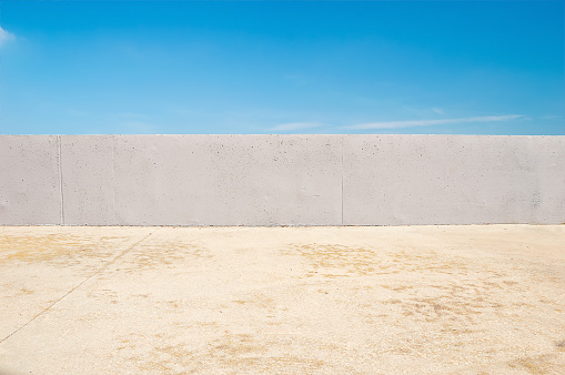 concrete wall with blue sky in background at the city park