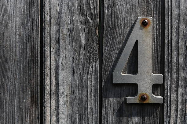istock Old wooden background with number four 590140926