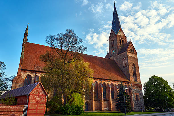 istock Medieval Gothic church with a bell tower 590141254