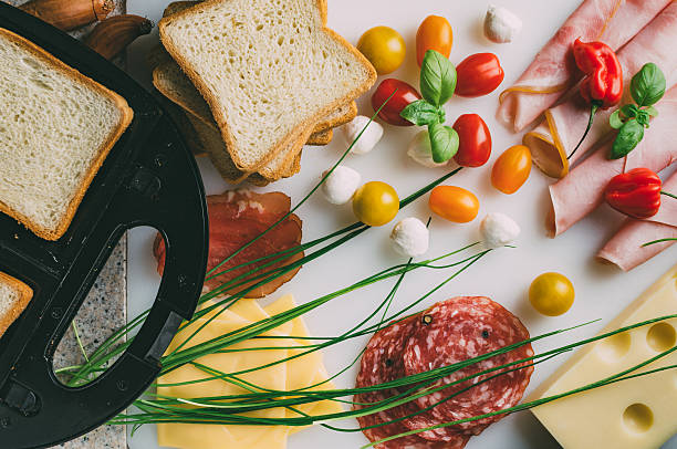 toast sandwich preparation. top view. - mozzarella tomato sandwich picnic imagens e fotografias de stock