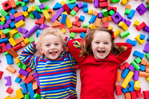 istock Children playing with colorful plastic blocks. 590142646