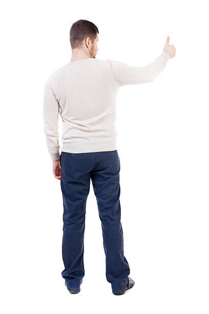istock Back view of  business man shows thumbs up 590143192