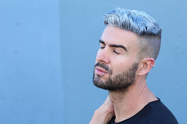 istock Young rebel man with white died hair 590143304