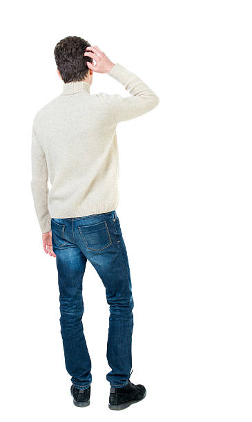 istock Back view of man . Standing young guy. 590143598