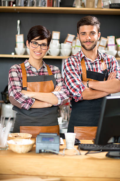 istock Happy owners of coffee shop 590143692