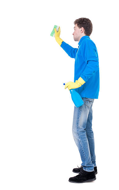 istock side view of a cleaner man in gloves with sponge 590143714
