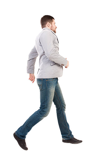 istock Back view of running business man. 590144134