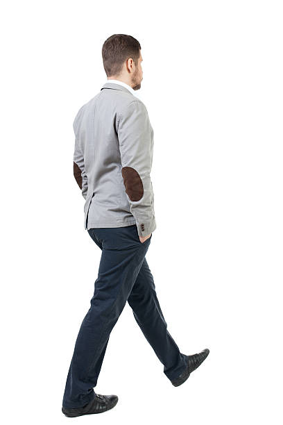istock Back view of walking businessman. 590144344