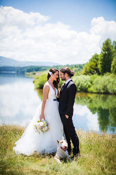istock Bride and groom wedding with dog 590144652