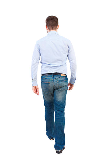 istock Back view of walking businessman. 590144660