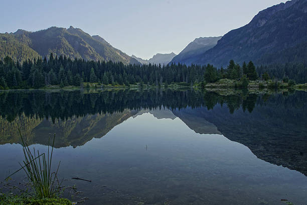 istock Morning Lake Reflection in Washington Cascades 590144732