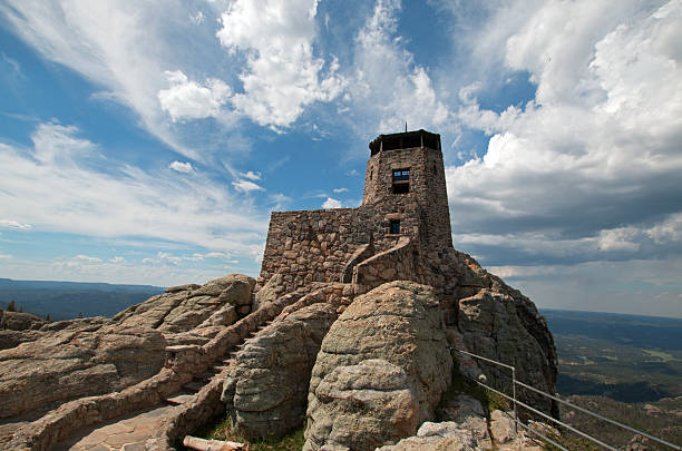 Harney Peak Fire Lookout Tower under cumulus sky Harney Peak Fire Lookout Tower in Custer State Parks Black Elk Wilderness in the Black Hills of South Dakota USA black hills photos stock pictures, royalty-free photos & images