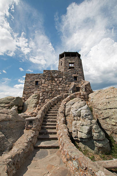 istock Harney Peak Fire Lookout Tower with cirrus cloudscape background 590145286