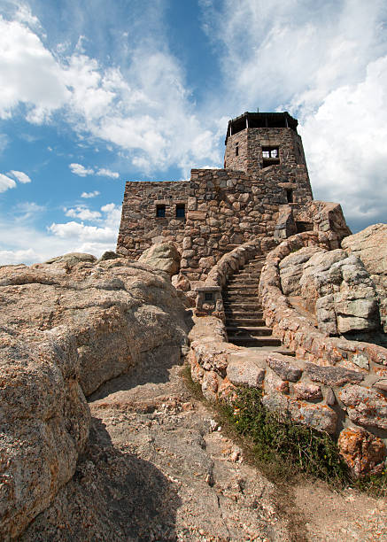 istock Harney Peak Fire Lookout Tower steps under cirrus cumulus cloudscape 590145322