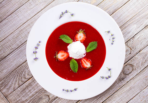 istock Strawberry soup with ice cream and mint 590145526
