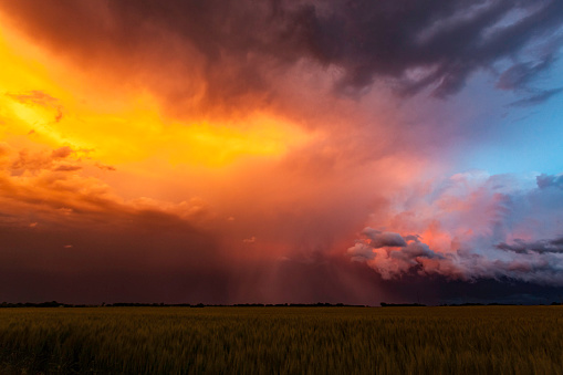 Spectacular sunset colours on storm clouds in US Mid-West Tornado Alley.  Horizontal, copy space.