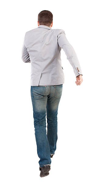 istock Back view of running business man. 590146128