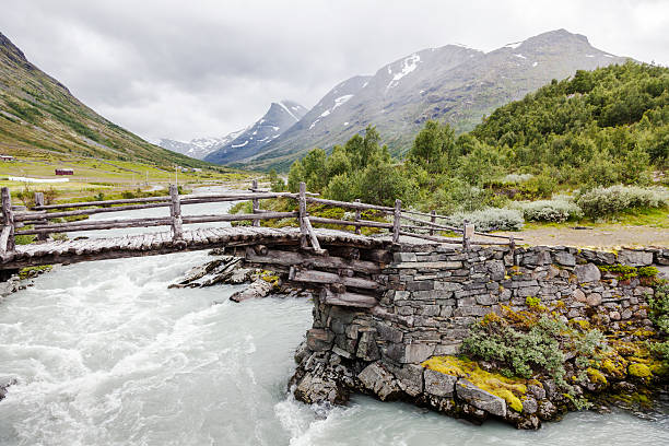 istock Mountain valley in August with some snow on the peaks. 590146214
