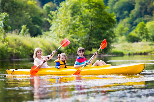istock Family enjoying kayak ride on a river 590147082