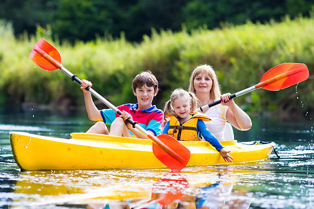 istock Family enjoying kayak ride on a beautiful river 590147694