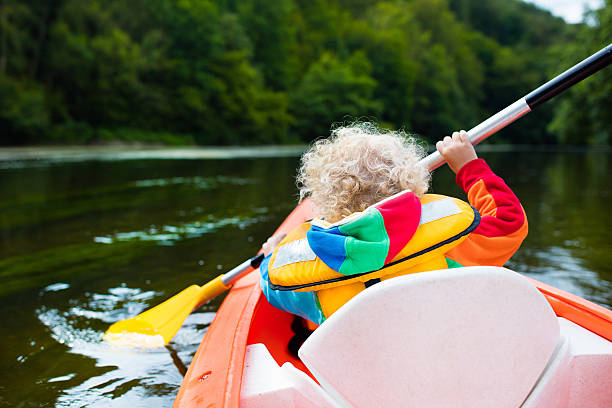istock Happy little boy in kayak 590148148