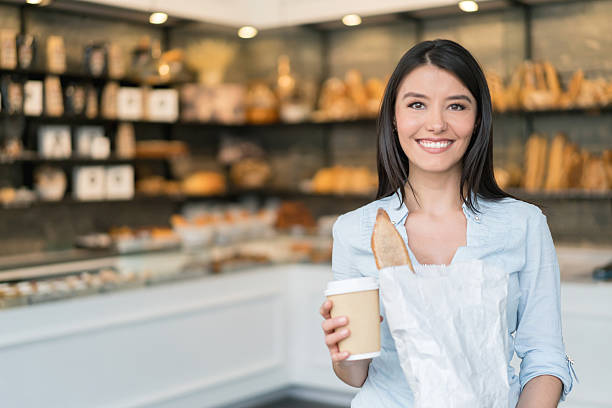 istock Happy woman shopping at the bakery 590149080