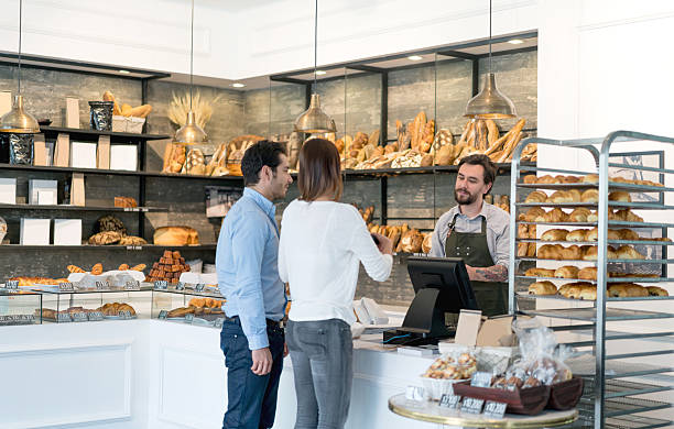istock Couple buying bread at the bakery 590149084