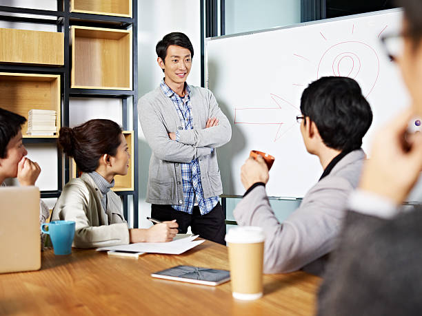 istock young asian business person facilitating a discussion 590149164