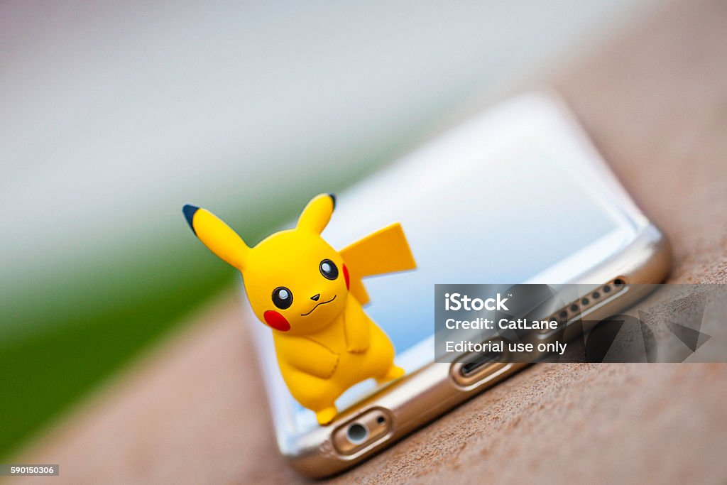Nintendo Pokemon Go Character Pikachu And Iphone Stock Photo - Download  Image Now - Apple Computers, Augmented Reality, Big Tech - iStock