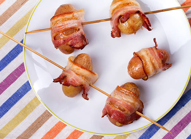 istock Bacon-wrapped potato in white plate 590150542
