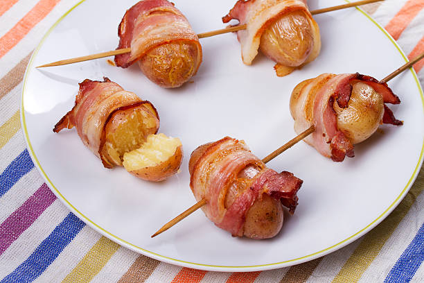 istock Bacon-wrapped potato in white plate 590150768
